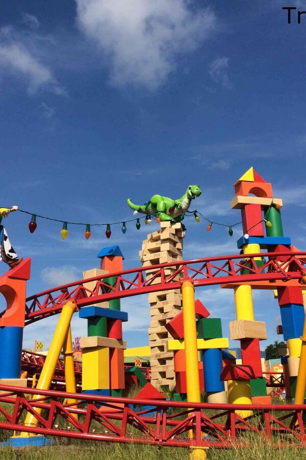 Slinky Dog track at Hollywood Studios with Jessie and Rex the dinosaur holding christmas lights above the track