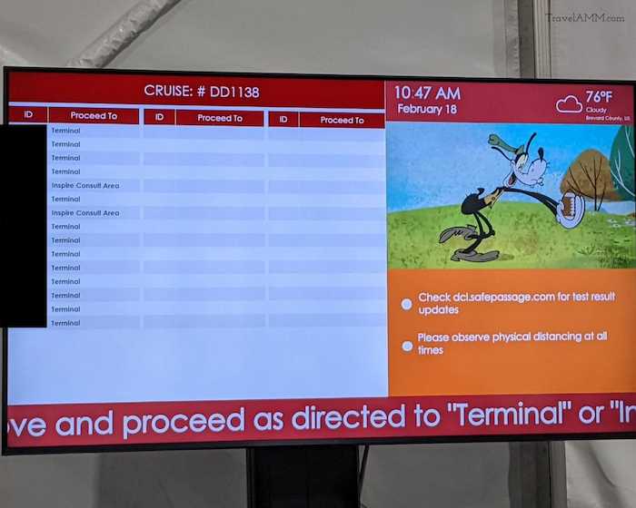 TV Screen in Port Canaveral waiting area detailing reservation numbers and test results