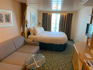 View of the interior of a spacious ocean view with balcony stateroom on Royal Caribbean's Independence of the Seas cruise ship