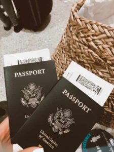 Two United States passports with airline tickets stuck inside them.