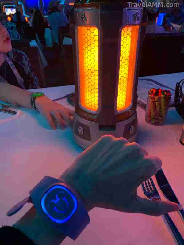 Example of DisneyBand+ lighting up during dinner in Worlds of Marvel aboard the Disney Wish.